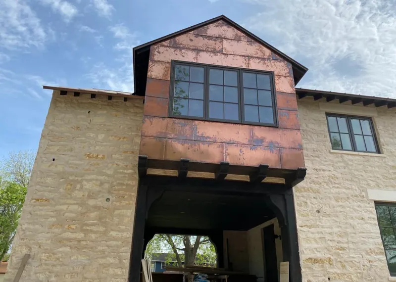 Copper metal panel facade on a stone building for Metal Roof Coating in Keizer